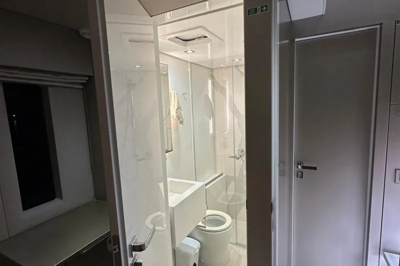 Dolphin Yacht Photos Pics Luxurious bathroom interior on a 2019 Sunreef 50 yacht, featuring modern fixtures and sleek design.