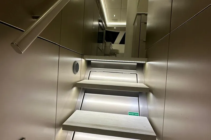 Dolphin Yacht Photos Pics Interior stairs of 2019 Sunreef 50 yacht with modern lighting and sleek design.