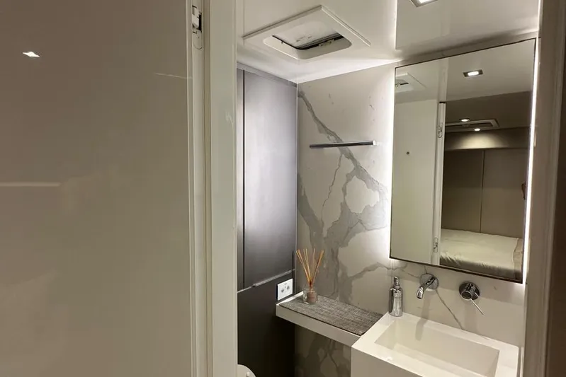Dolphin Yacht Photos Pics Luxurious bathroom interior of 2019 Sunreef 50 yacht with modern fixtures and elegant design.