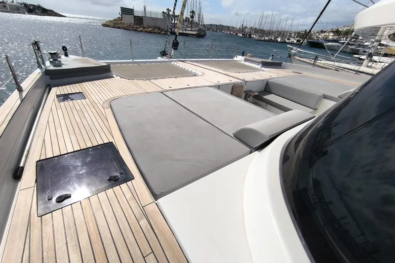 Dolphin Yacht Photos Pics 2019 Sunreef 50 yacht deck with seating, overlooking marina and ocean.
