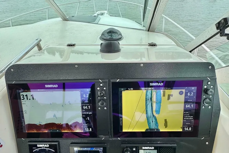  Yacht Photos Pics Dashboard of a 2004 Pursuit 2870 Walkaround boat with Simrad navigation displays.