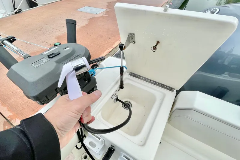  Yacht Photos Pics 2004 Pursuit 2870 Walkaround boat sink and control panel close-up.