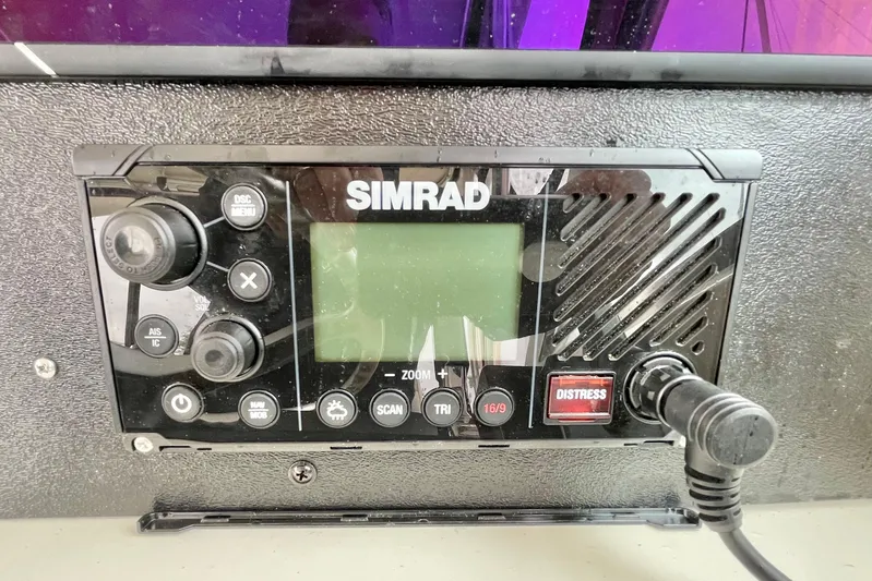  Yacht Photos Pics Simrad marine radio on 2004 Pursuit 2870 Walkaround boat dashboard.