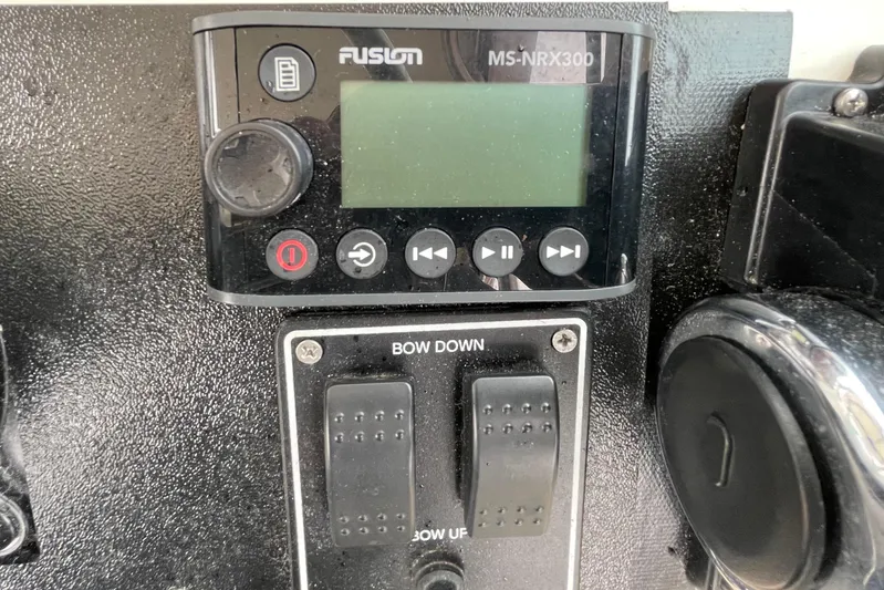  Yacht Photos Pics Control panel of a 2004 Pursuit 2870 Walkaround boat with Fusion MS-NRX300.