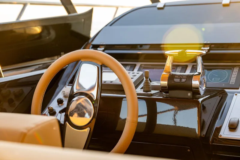  Yacht Photos Pics Helm of 2007 Riva Rivale 52 yacht with steering wheel and controls.