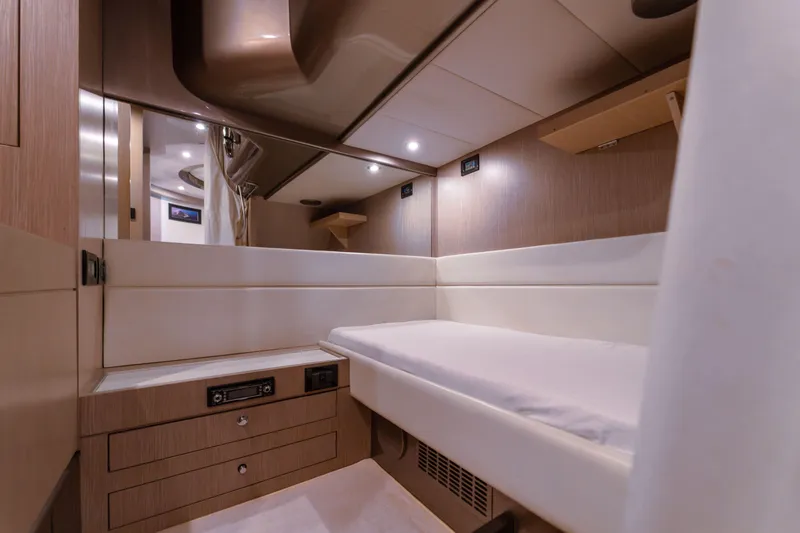  Yacht Photos Pics Interior cabin of 2007 Riva Rivale 52 yacht, featuring sleek wood finish and modern design.