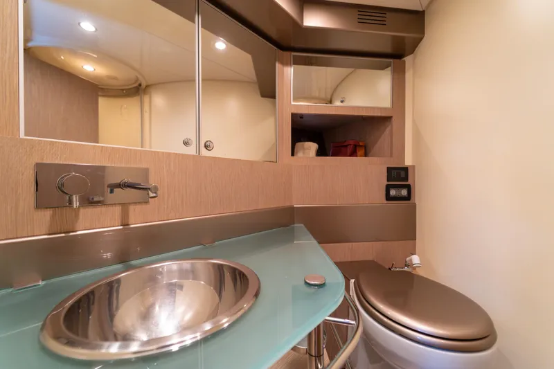  Yacht Photos Pics Luxury bathroom interior of 2007 Riva Rivale 52 yacht with modern fixtures.
