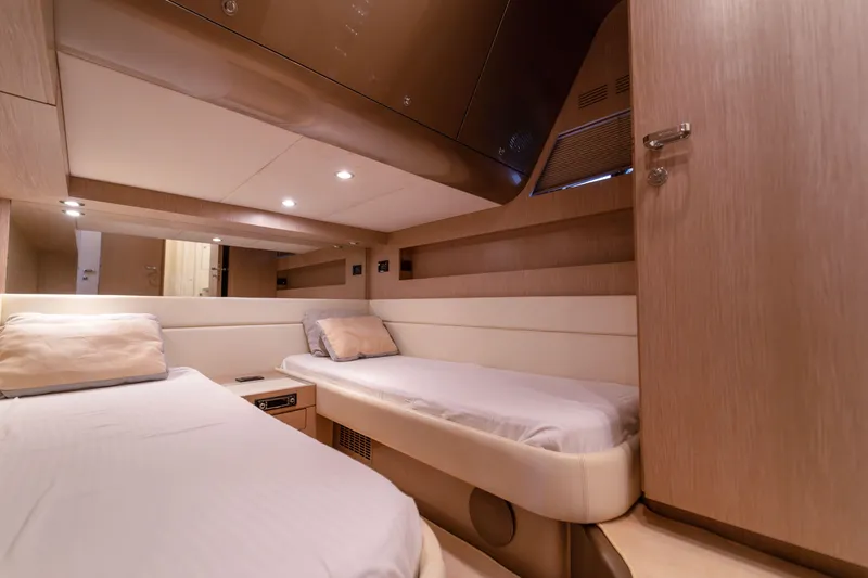  Yacht Photos Pics Luxurious cabin interior of 2007 Riva Rivale 52 yacht with twin beds.