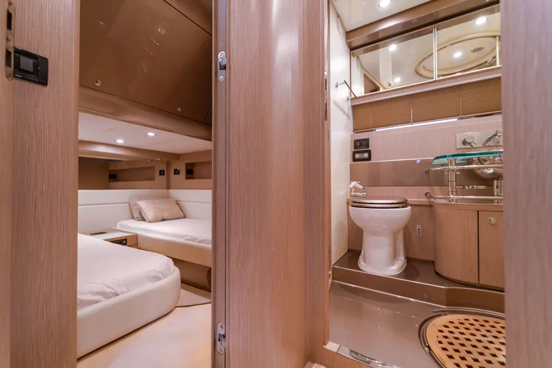  Yacht Photos Pics Luxurious interior of 2007 Riva Rivale 52 yacht, featuring bedroom and bathroom.