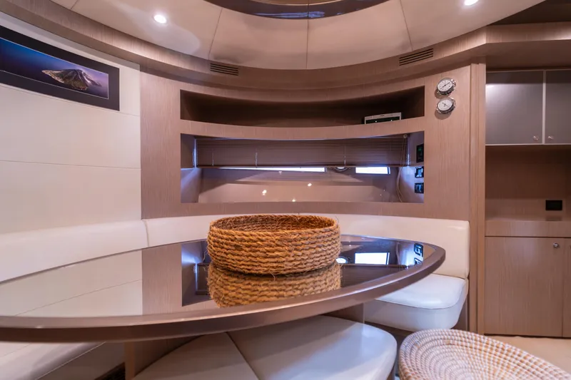  Yacht Photos Pics Luxurious interior of 2007 Riva Rivale 52 yacht with elegant dining area.
