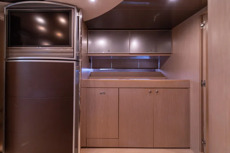  Yacht Photos Pics Interior of 2007 Riva Rivale 52 yacht with modern cabinetry and built-in TV.