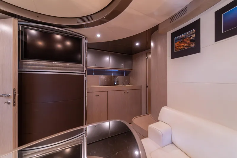  Yacht Photos Pics Luxurious interior of 2007 Riva Rivale 52 yacht with modern furnishings and sleek design.