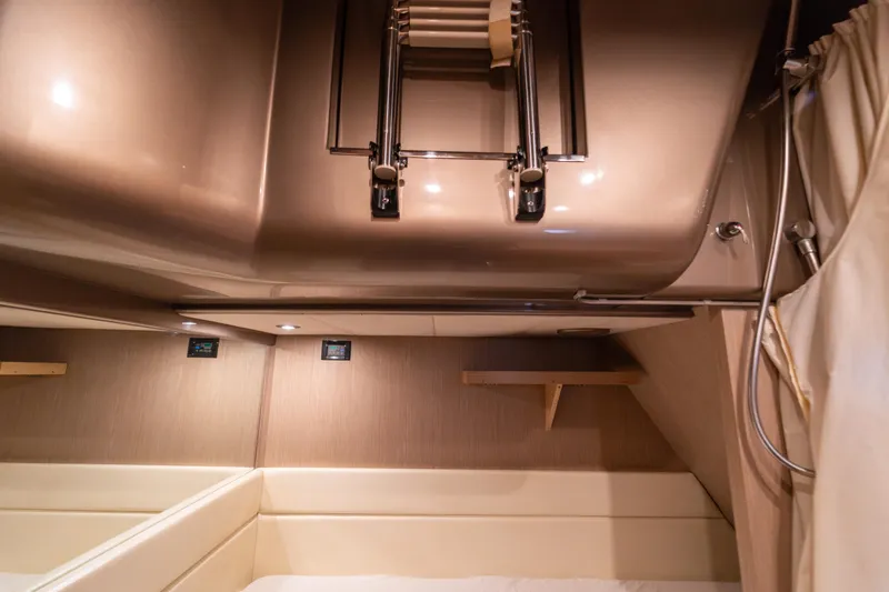  Yacht Photos Pics Interior cabin of 2007 Riva Rivale 52 yacht with modern design and beige upholstery.