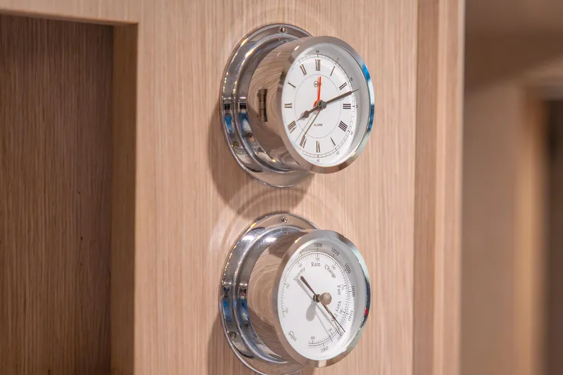  Yacht Photos Pics Wall-mounted clock and barometer on 2007 Riva Rivale 52 yacht interior.