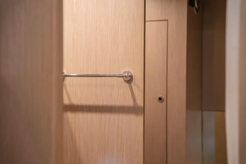  Yacht Photos Pics Wooden interior detail of 2007 Riva Rivale 52 yacht, featuring a sleek towel rack.