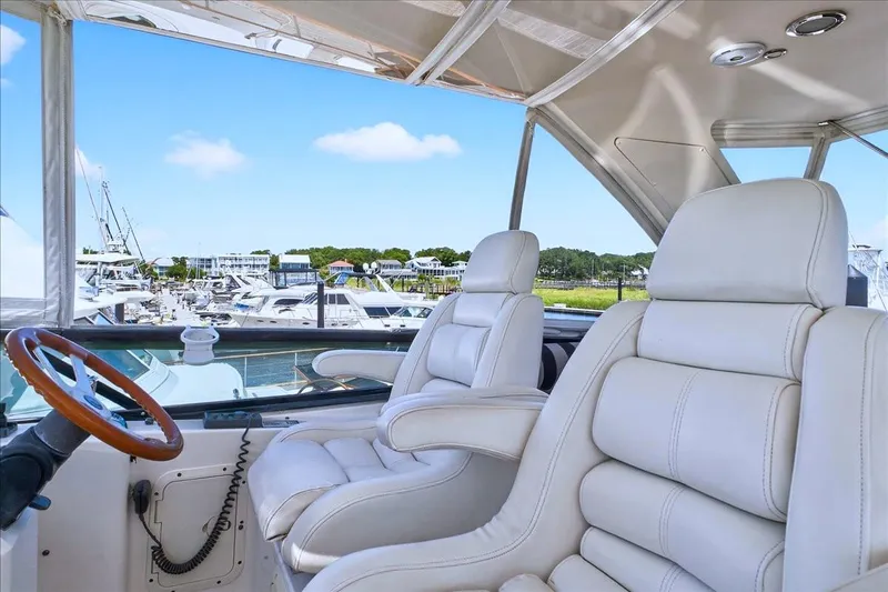  Yacht Photos Pics Luxurious Neptunus 56 Flybridge yacht interior with white leather seats, 2004 model.