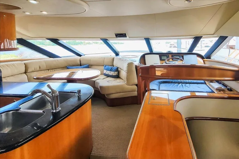  Yacht Photos Pics Luxurious interior of 2004 Neptunus 56 Flybridge yacht with plush seating and modern amenities.