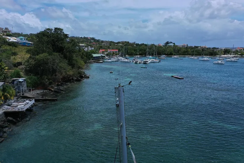 Viewfinder Yacht Photos Pics Coastal view with boats and lush greenery, captured from a Bali 4.1 catamaran, 2020.