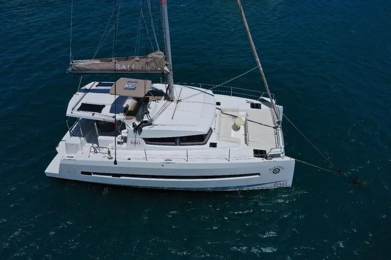 Viewfinder Yacht Photos Pics Aerial view of a 2020 Bali 4.1 catamaran sailing on blue water.