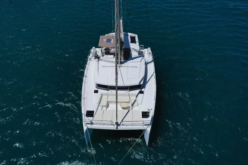 Viewfinder Yacht Photos Pics 2020 Bali 4.1 catamaran sailing on clear blue water, aerial view.