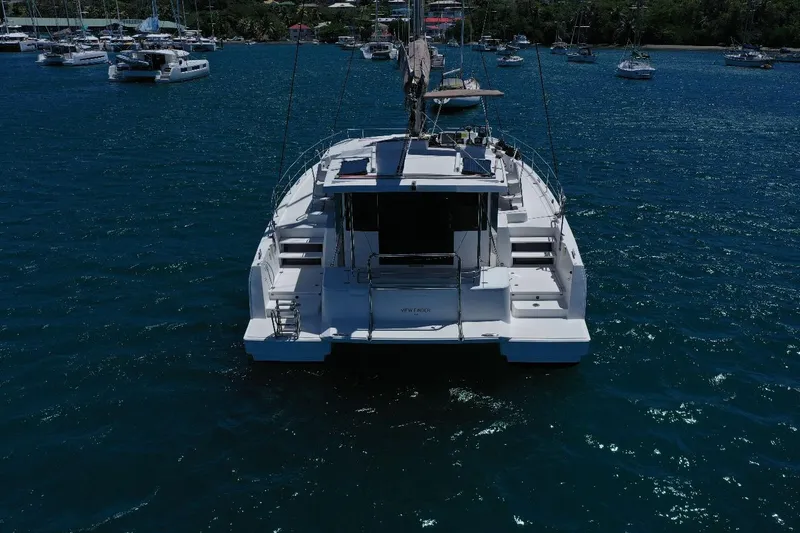 Viewfinder Yacht Photos Pics Sailing catamaran Bali 4.1, 2020 model, anchored in a serene bay.