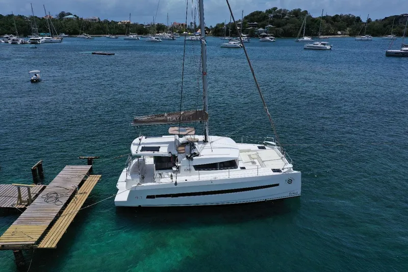 Viewfinder Yacht Photos Pics 2020 Bali 4.1 catamaran docked in a serene marina with surrounding boats.
