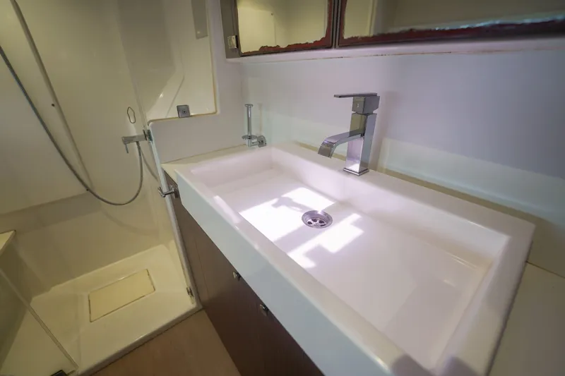 Viewfinder Yacht Photos Pics Modern bathroom sink and shower in a 2020 Bali 4.1 model yacht.