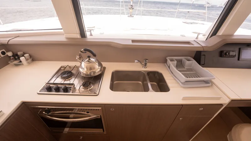 Viewfinder Yacht Photos Pics Modern kitchen in 2020 Bali 4.1 yacht with stove, sink, and ocean view.