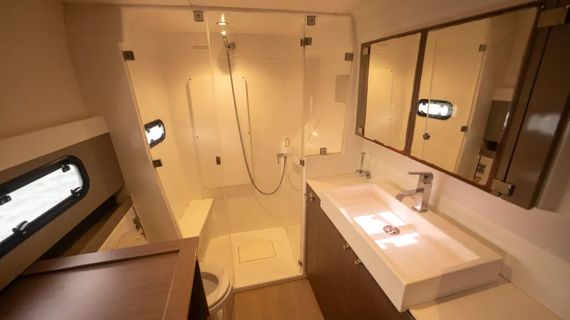 Viewfinder Yacht Photos Pics Modern bathroom interior on a 2020 Bali 4.1 yacht, featuring a shower and sleek fixtures.