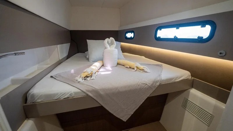 Viewfinder Yacht Photos Pics Cozy cabin interior of 2020 Bali 4.1 yacht with neatly arranged bed linens.