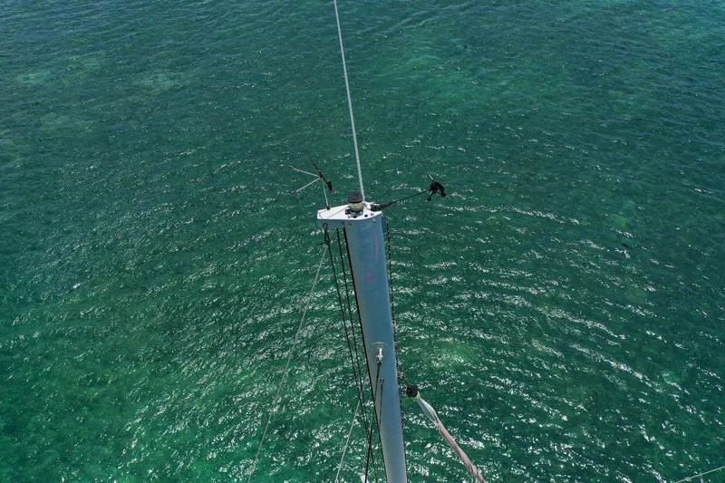 Viewfinder Yacht Photos Pics Aerial view of Bali 4.1 sailboat mast over clear turquoise water, 2020 model.