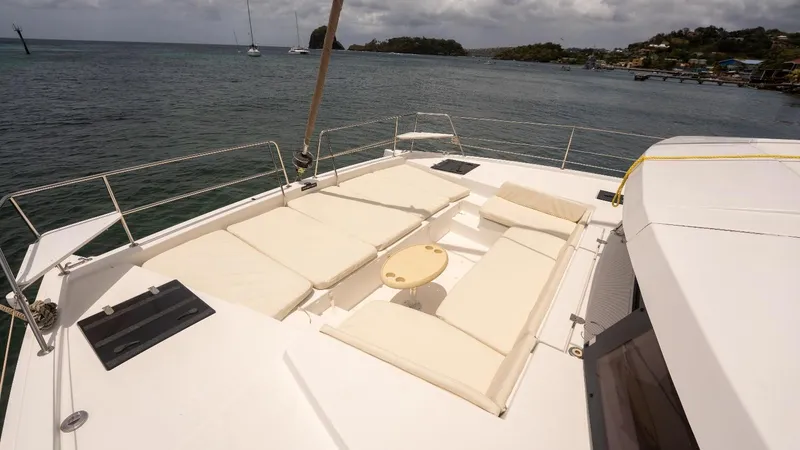 Viewfinder Yacht Photos Pics Luxurious Bali 4.1 catamaran deck with sun loungers, 2020 model, overlooking serene ocean view.