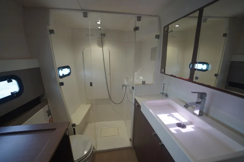 Viewfinder Yacht Photos Pics Modern bathroom in 2020 Bali 4.1 yacht with shower, sink, and mirror.