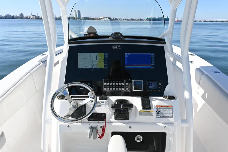  Yacht Photos Pics 2020 Sea Fox 288 Commander boat dashboard with navigation screens and steering wheel.