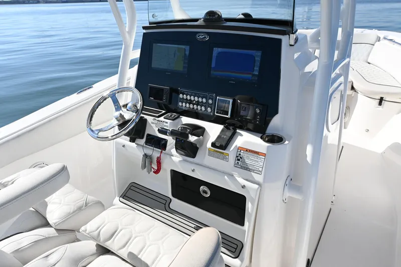  Yacht Photos Pics 2020 Sea Fox 288 Commander boat dashboard with steering wheel and navigation controls.