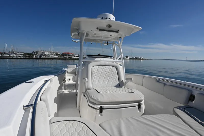  Yacht Photos Pics 2020 Sea Fox 288 Commander boat interior with white seating, docked at marina.