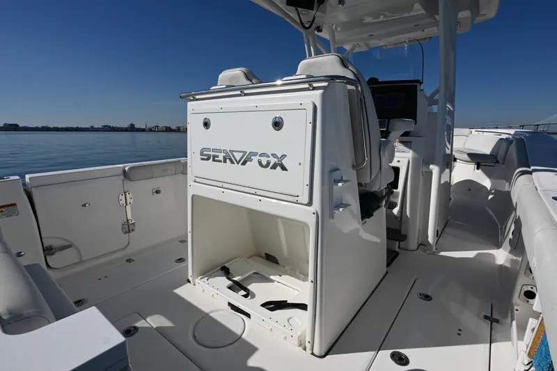  Yacht Photos Pics 2020 Sea Fox 288 Commander boat interior with seating and storage, on calm water.
