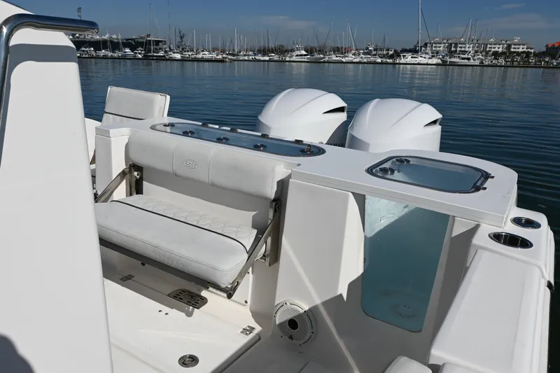 Yacht Photos Pics 2020 Sea Fox 288 Commander boat interior with seating and dual engines in marina.