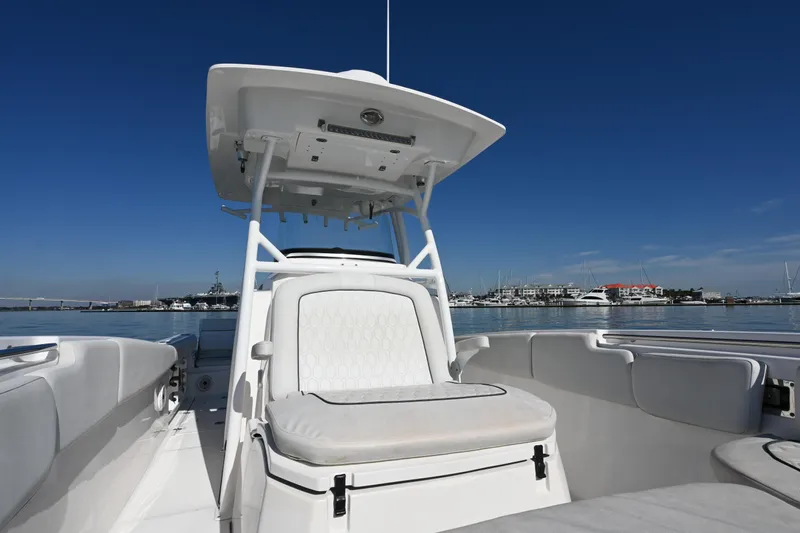  Yacht Photos Pics 2020 Sea Fox 288 Commander boat interior with seating, under clear blue sky.