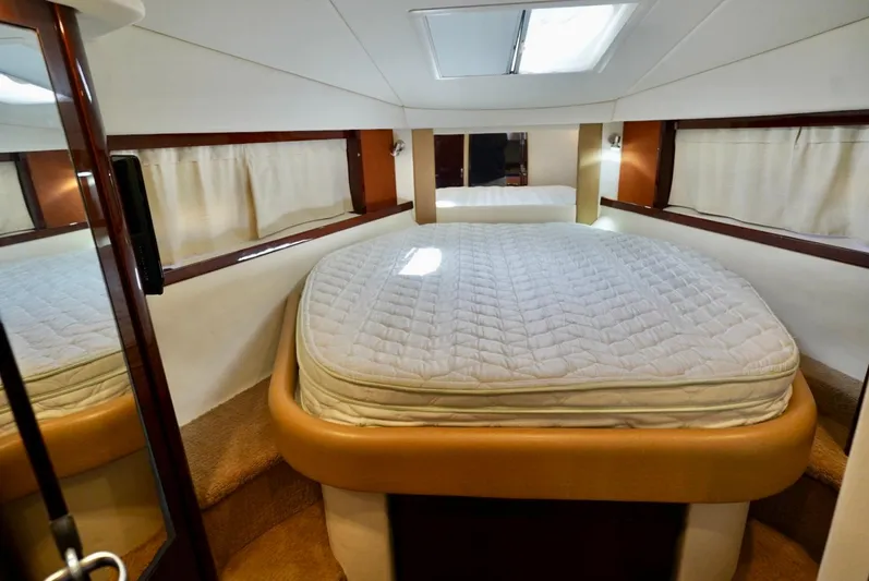  Yacht Photos Pics Luxurious cabin interior of 2010 Sea Ray 390 Sundancer yacht with cozy bed.