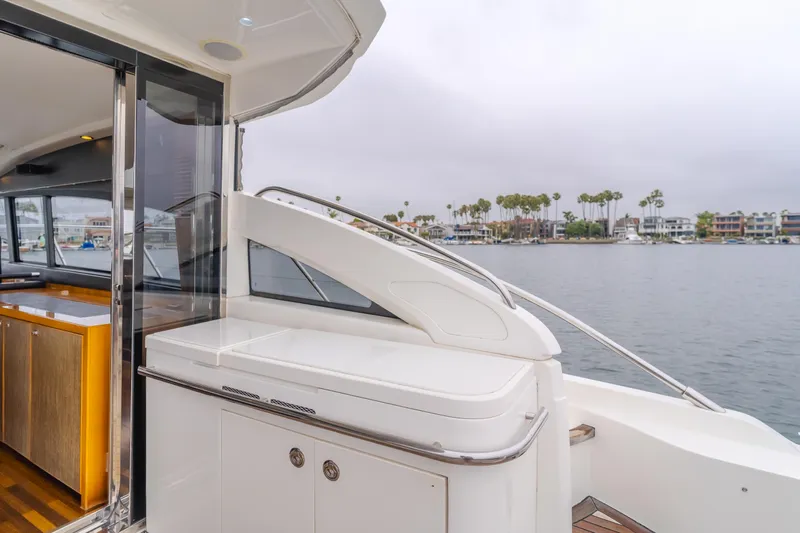 Release Me Yacht Photos Pics 2013 Princess V52 yacht deck with sleek design and waterfront view.