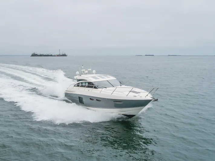 Release Me Yacht Photos Pics 2013 Princess V52 yacht cruising on open water.