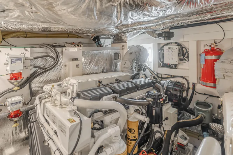 Release Me Yacht Photos Pics Engine room of 2013 Princess V52 yacht, featuring advanced machinery and safety equipment.