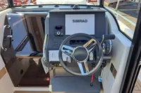 2023 Nimbus Commuter 8 dashboard with steering wheel and Simrad navigation system.