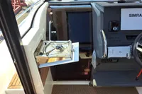 2023 Nimbus Commuter 8 boat interior with stove and control panel.
