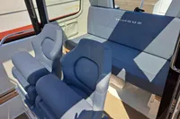 Interior of 2023 Nimbus Commuter 8 with blue seating and modern design.