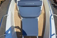 2023 Nimbus Commuter 8 boat with sleek seating and teak deck.