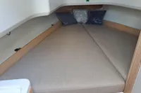2023 Nimbus Commuter 8 cabin interior with cozy bed and pillows.