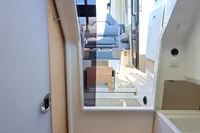 Interior of 2023 Nimbus Commuter 8 boat, featuring modern seating and sleek design elements.