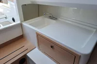 2023 Nimbus Commuter 8 interior sink with wooden cabinetry and modern design.